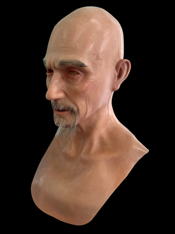 Left side profile of old man mask revealing fine detailing of ears and jawline