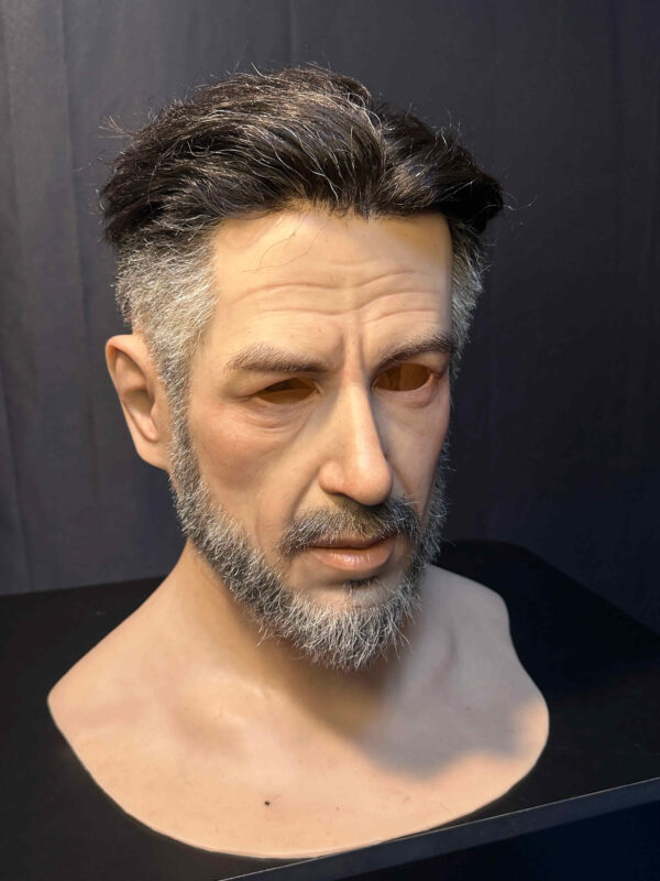 Right side profile of hyper realistic mask highlighting fine skin details and realistic craftsmanship.