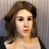 Right side profile of realistic masks showing the lifelike features of a short-haired girl