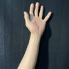 Back view of realistic silicone gloves displaying wrist and palm realism
