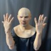 Realistic silicone gloves being worn on a human hand