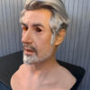 Left profile of realistic silicone masks elderly man white hair