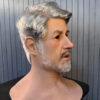 Right angle view of platinum silicone elderly man masks