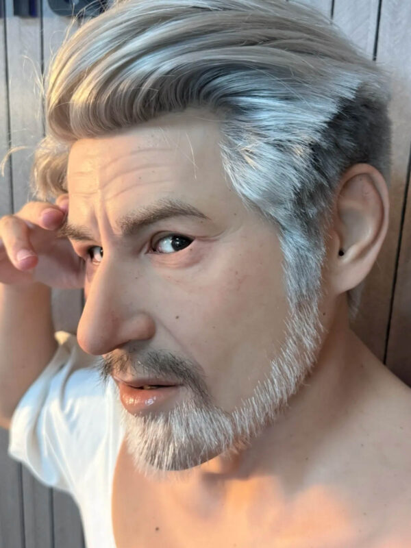 Side view of actor wearing realistic silicone elderly mask