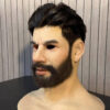 Left profile of a realistic silicone face mask with defined cheekbone and beard texture
