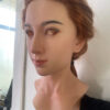 Realistic female mask right side profile with long brown hair
