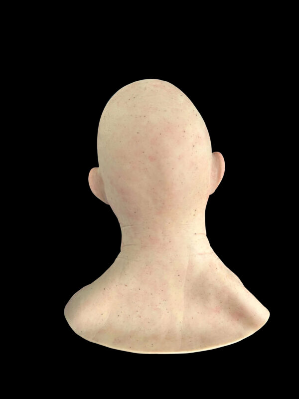 Back view of bald elderly silicon mask showing neck and edges