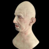 Side angle of elderly man silicon mask with detailed wrinkles
