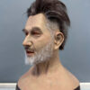 Left side view of white-bearded silicone mask for cosplay or film