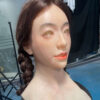 Silicone masks female left side profile with natural hair and facial detail